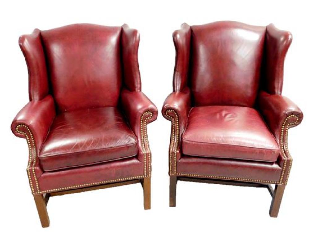 Appraisal: Pair of Chippendale style burgundy leather wing chairs Old Hickory