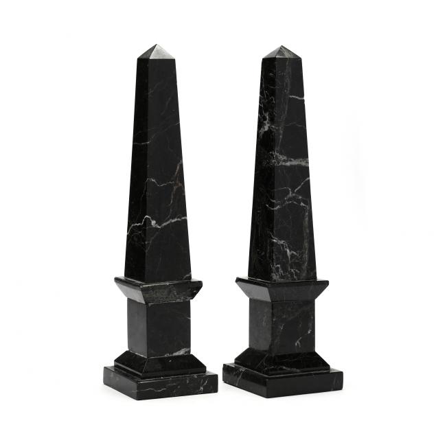 Appraisal: A PAIR OF BLACK MARBLE OBELISKS th century five-part polished