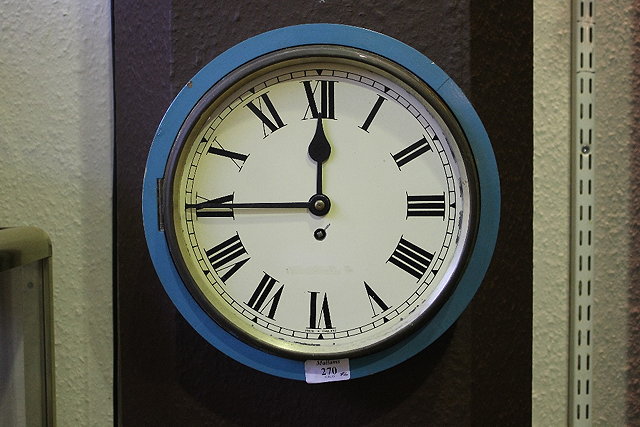 Appraisal: A WALL CLOCK with painted enamel dial with Roman numerals