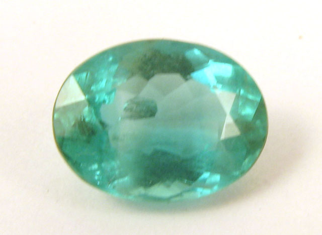 Appraisal: UNSET OVAL-CUT GREEN EMERALD measuring x x mm and weighing