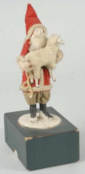 Appraisal: Japanese-Dressed Santa Holding Lamb Description Santa and lamb both with