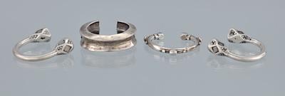 Appraisal: A Group of Four Ethnic Design Silver Cuff Bracelets Containing