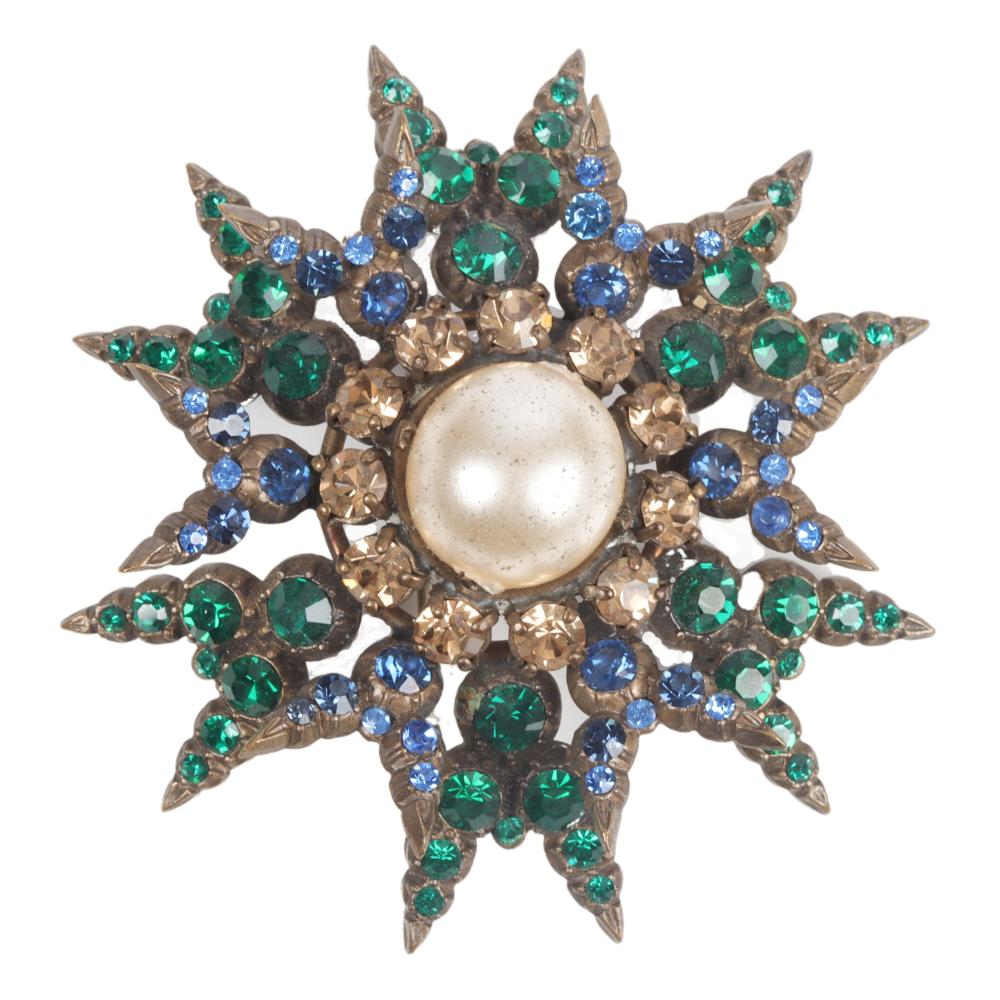 Appraisal: DIMENSIONAL STARBURST PIN WITH CENTRAL FAUX PEARL V S LINED