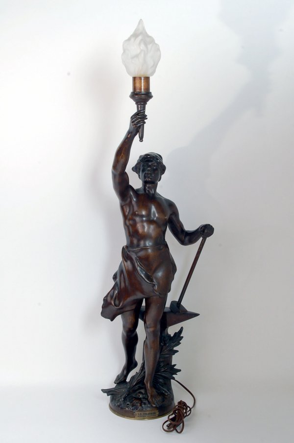 Appraisal: Le Travail cast metal figural lamp Bronze finish Label to