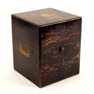 Appraisal: A coromandel wood decanter box with countersunk handles to the