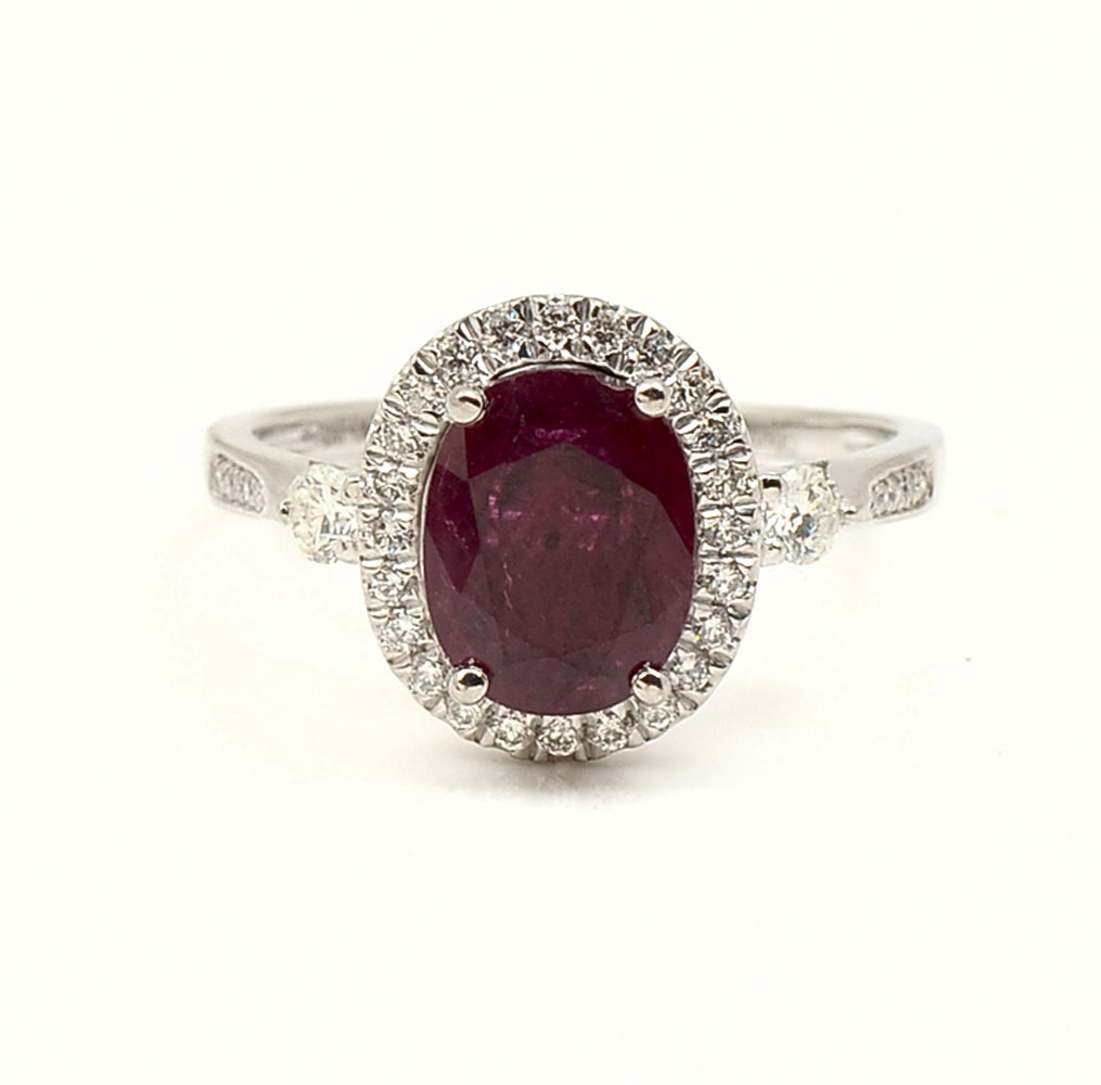 Appraisal: PLATINUM RUBY DIAMOND RING Cabernet red CT oval ruby is