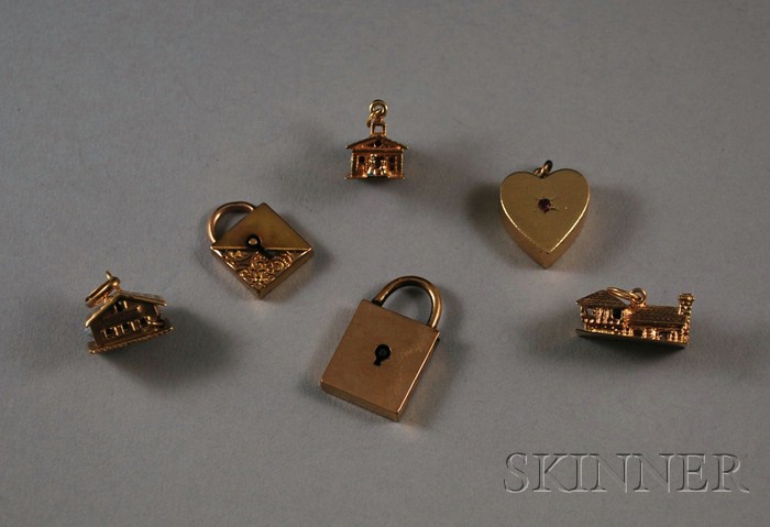 Appraisal: Six Small Gold Charms and Locks two kt gold locks