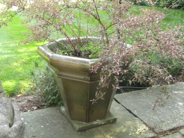 Appraisal: A pair of celadon glazed octagonal garden planters of tapering