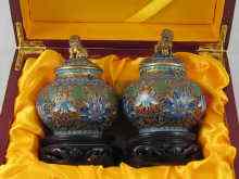 Appraisal: A pair of Chinese cloisonne enamelled covered vases with temple