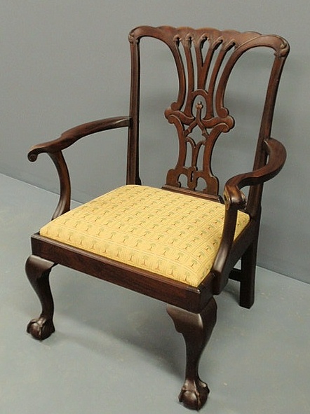 Appraisal: Chippendale mahogany open armchair with a pierced carved crest slip