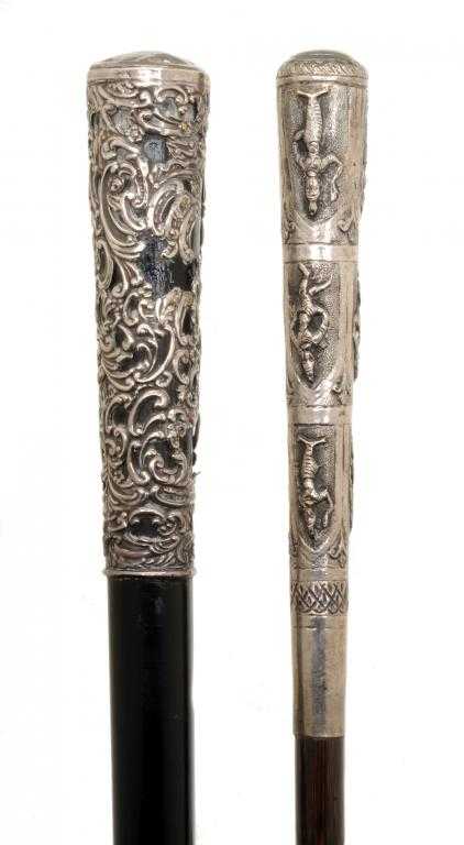 Appraisal: A SOUTH EAST ASIAN SILVER REPOUSS -HANDLED BAMBOO WALKING CANE