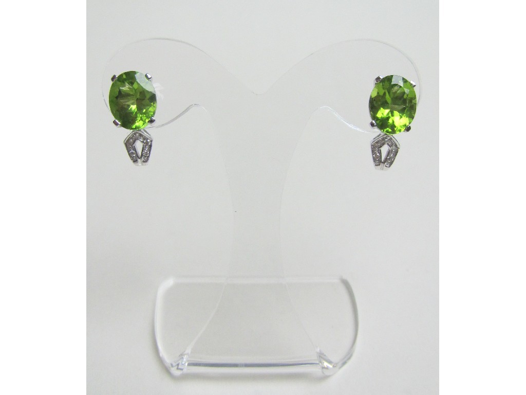 Appraisal: Fourteen carat white gold peridot and diamond set stud earrings