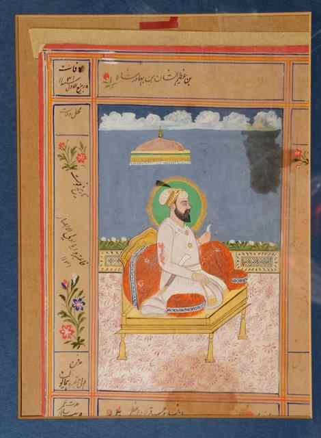 Appraisal: MUGHAL SCHOOLA kneeling figure within a painted border with Islamic