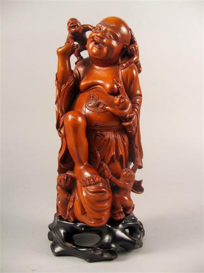 Appraisal: Chinese carved boxwood Budai th century Standing figure with leg