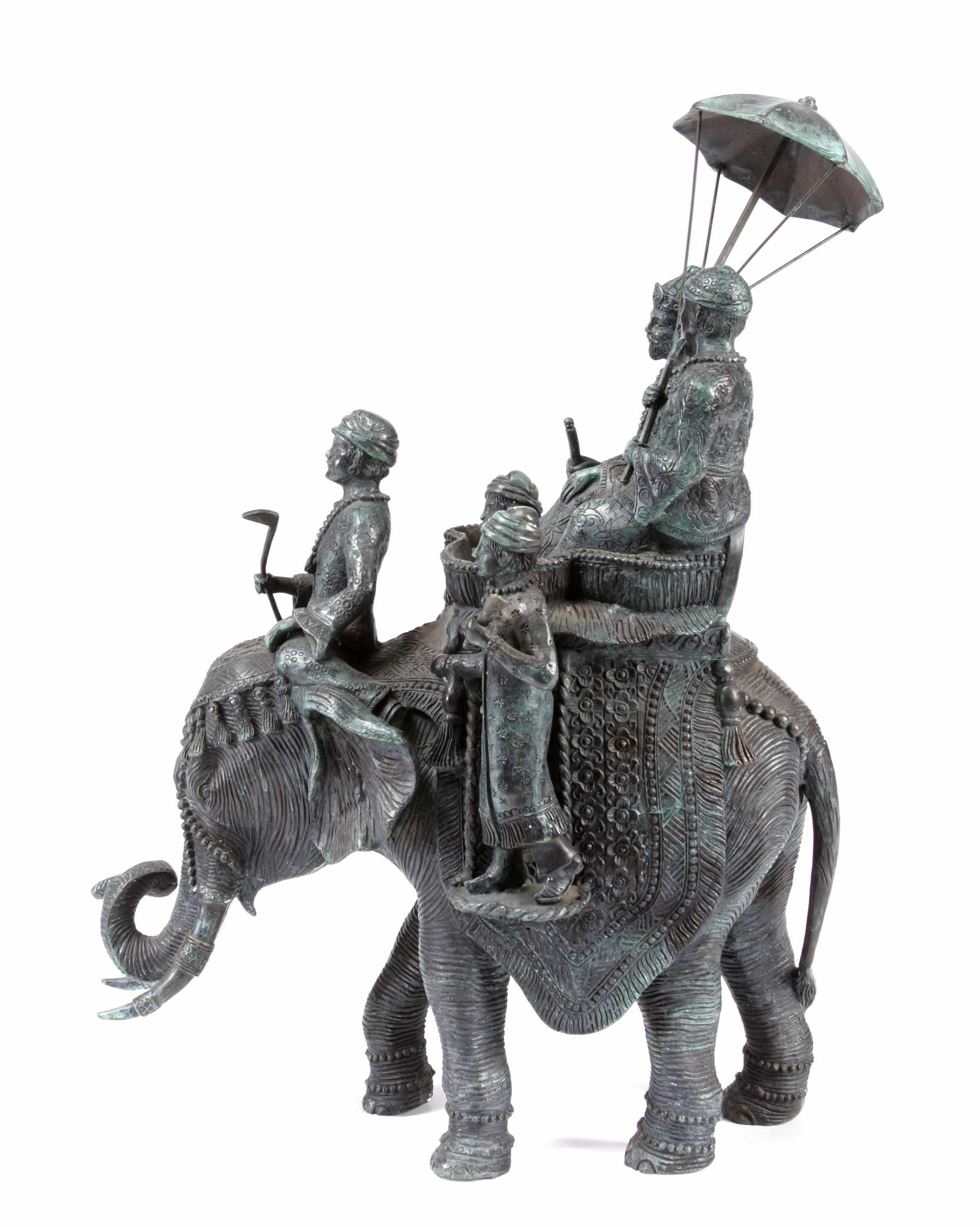 Appraisal: A patinated bronze figural group depicting an elephant rideheight in