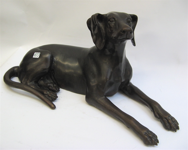 Appraisal: ARTIST SIGNED BRONZE SCULPTURE of a young dog reclining incised