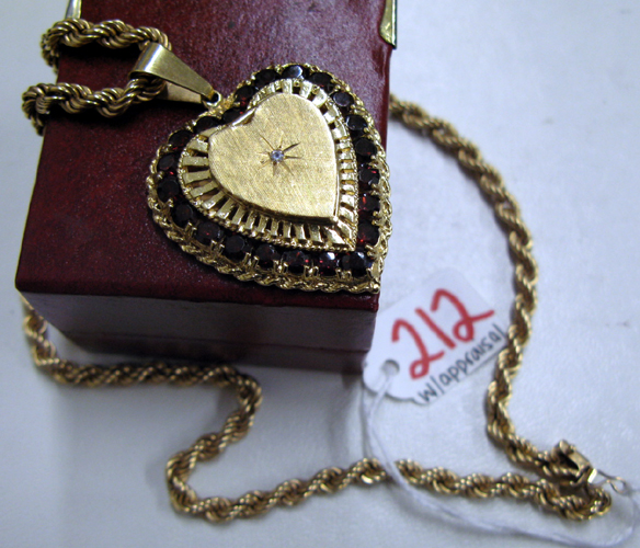 Appraisal: GARNET DIAMOND AND FOURTEEN KARAT GOLD HEART SHAPED LOCKET AND