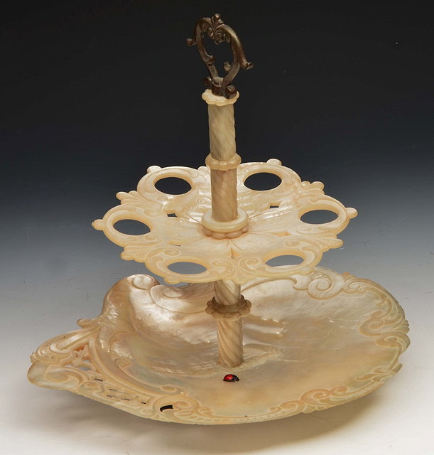 Appraisal: A FRENCH CARVED SHELL TWO TIER TAZZA with brass carrying