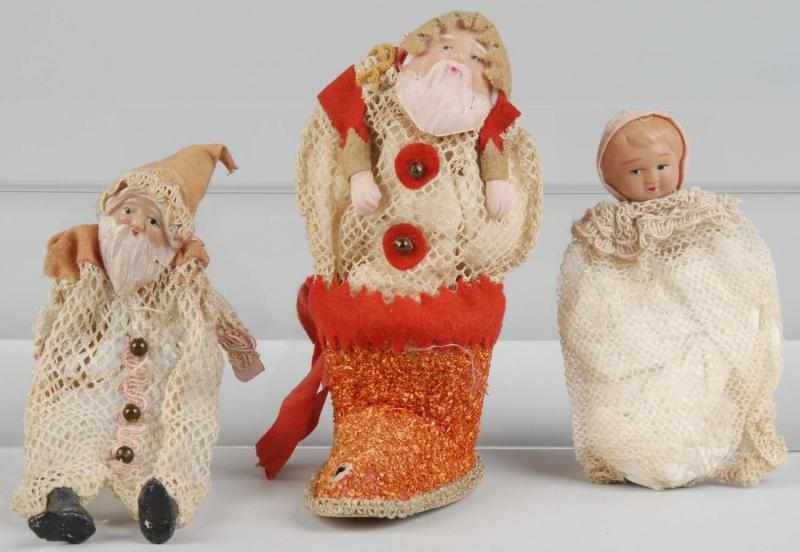 Appraisal: Lot of Celluloid-Faced Christmas Ornaments Description Includes Santa in boot