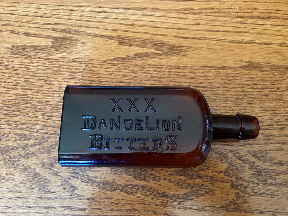 Appraisal: XXX Dandelion Bitters Amber Bottle XXX Dandelion Bitters Amber Bottle