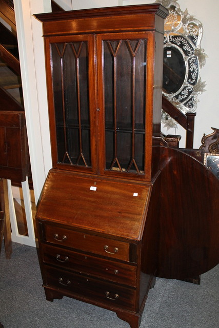 Appraisal: AN EDWARDIAN MAHOGANY BUREAU BOOKCASE the upper section enclosed by