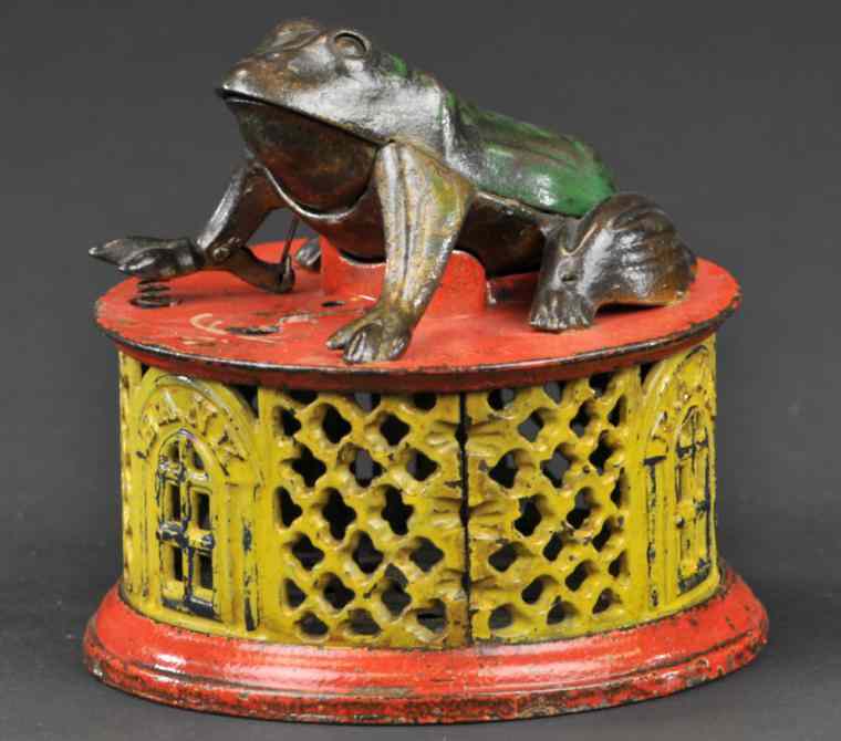 Appraisal: FROG ON ROUND BASE MECHANICAL BANK Red and yellow lattice