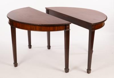 Appraisal: A pair of mahogany side tables with carved borders and