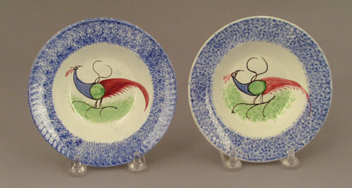 Appraisal: Two blue spatter cup plates th c with peafowl dia