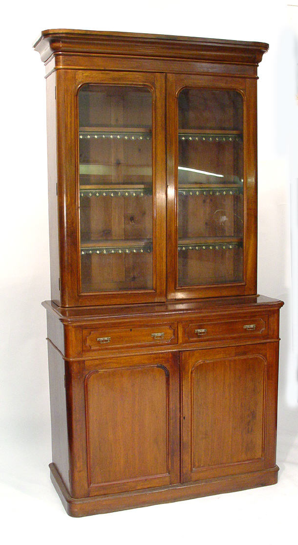 Appraisal: Victorian mahogany bookcase the moulded cornice above a pair of