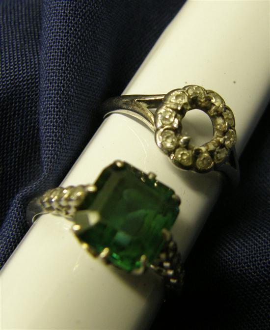 Appraisal: Platinum ring set with a green stone flanked by eight