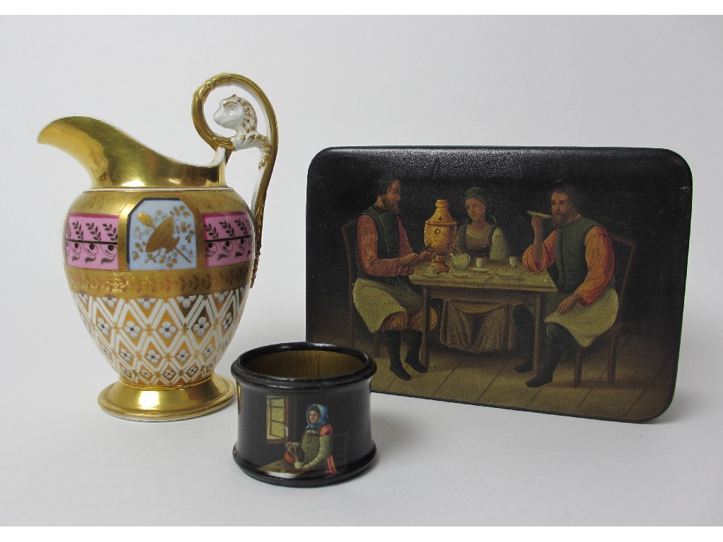 Appraisal: A Russian lacquered box decorated with three figures seated around