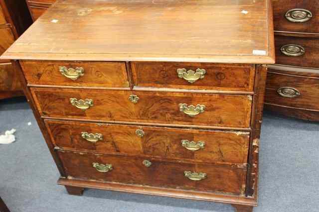 Appraisal: AN TH CENTURY WALNUT CHEST of two short and three