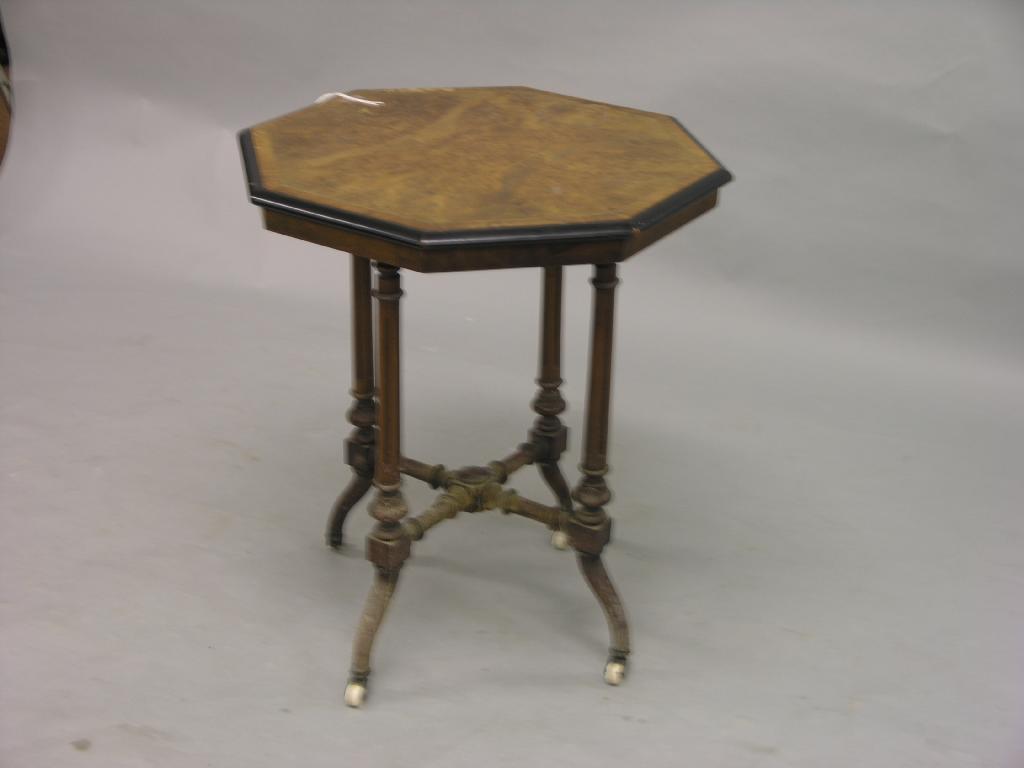 Appraisal: A Victorian burr walnut occasional table octagonal quarter-veneered top supported