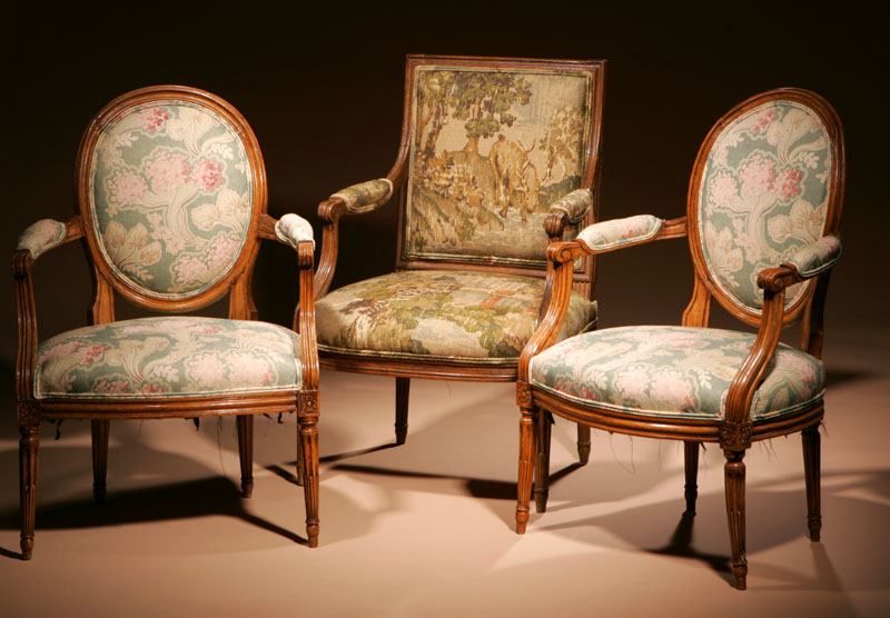 Appraisal: Three Louis XVI beechwood and walnut fauteuils I B Sene