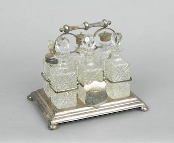 Appraisal: A Silver Plate Cruet Set Oblong silver plate holder raised