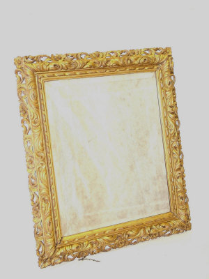 Appraisal: A Continental carved and giltwood rectangular mirror frame with pierced