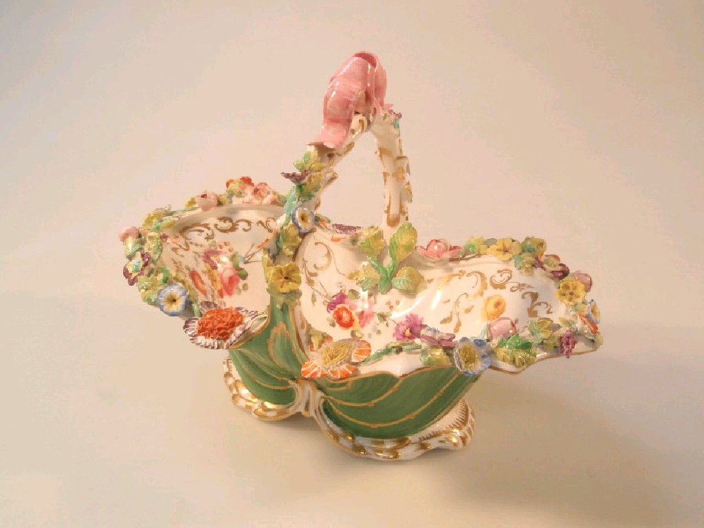 Appraisal: A thC Coalport flower encrusted basket profusely decorated with a