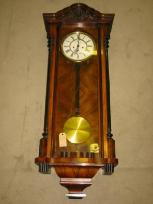 Appraisal: A VIENNA WALL CLOCK the twin weight driven movement with