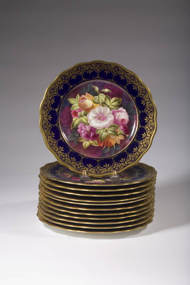 Appraisal: SET OF TWELVE ENGLISH CAULDON PLATES WITH ELABORATE FLORAL DECORATION