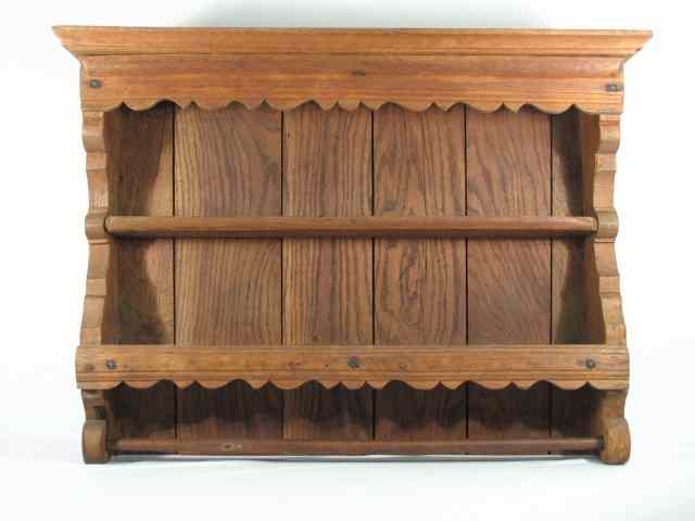 Appraisal: A rustic style th century three tier wall shelf with