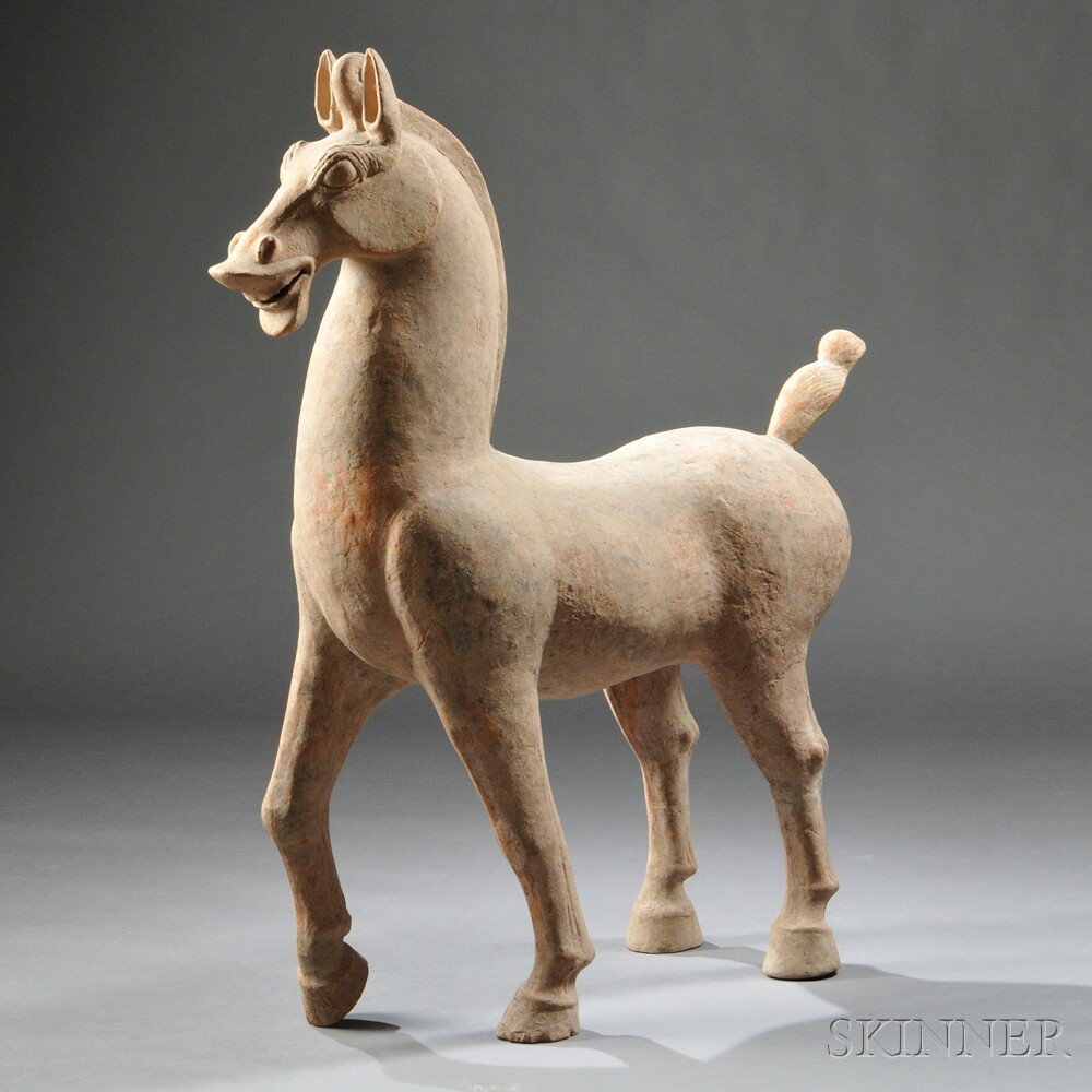 Appraisal: Terra-cotta Han-style Horse China in prancing pose with its one