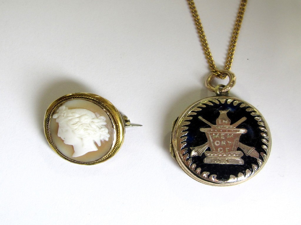 Appraisal: A yellow metal and black enamelled photo locket and a