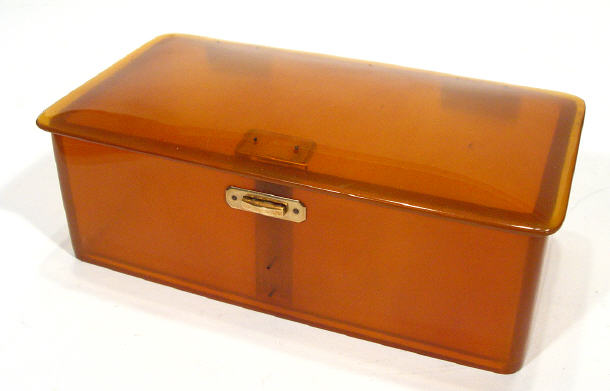 Appraisal: Good quality rectangular amber coloured composite or perspex box with