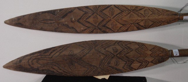 Appraisal: A pair of Papua New Guinean decorated paddles cm high