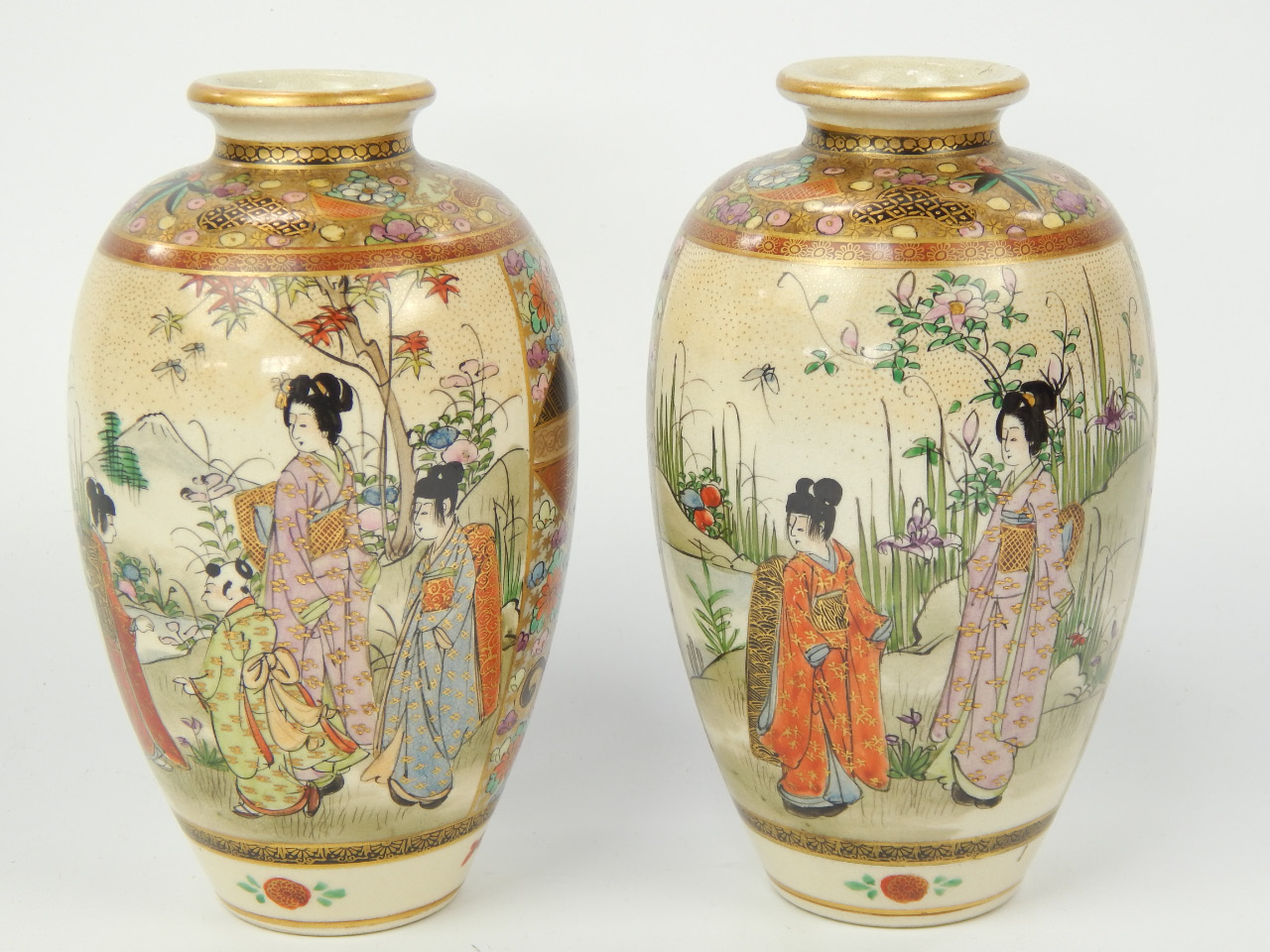 Appraisal: A pair of Japanese satsuma vases of ovoid shape decorated