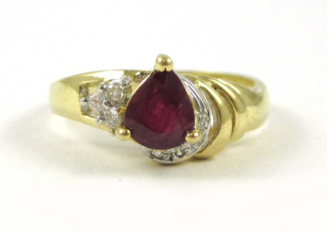 Appraisal: RUBY DIAMOND AND FOURTEEN KARAT GOLD RING with seven round-cut