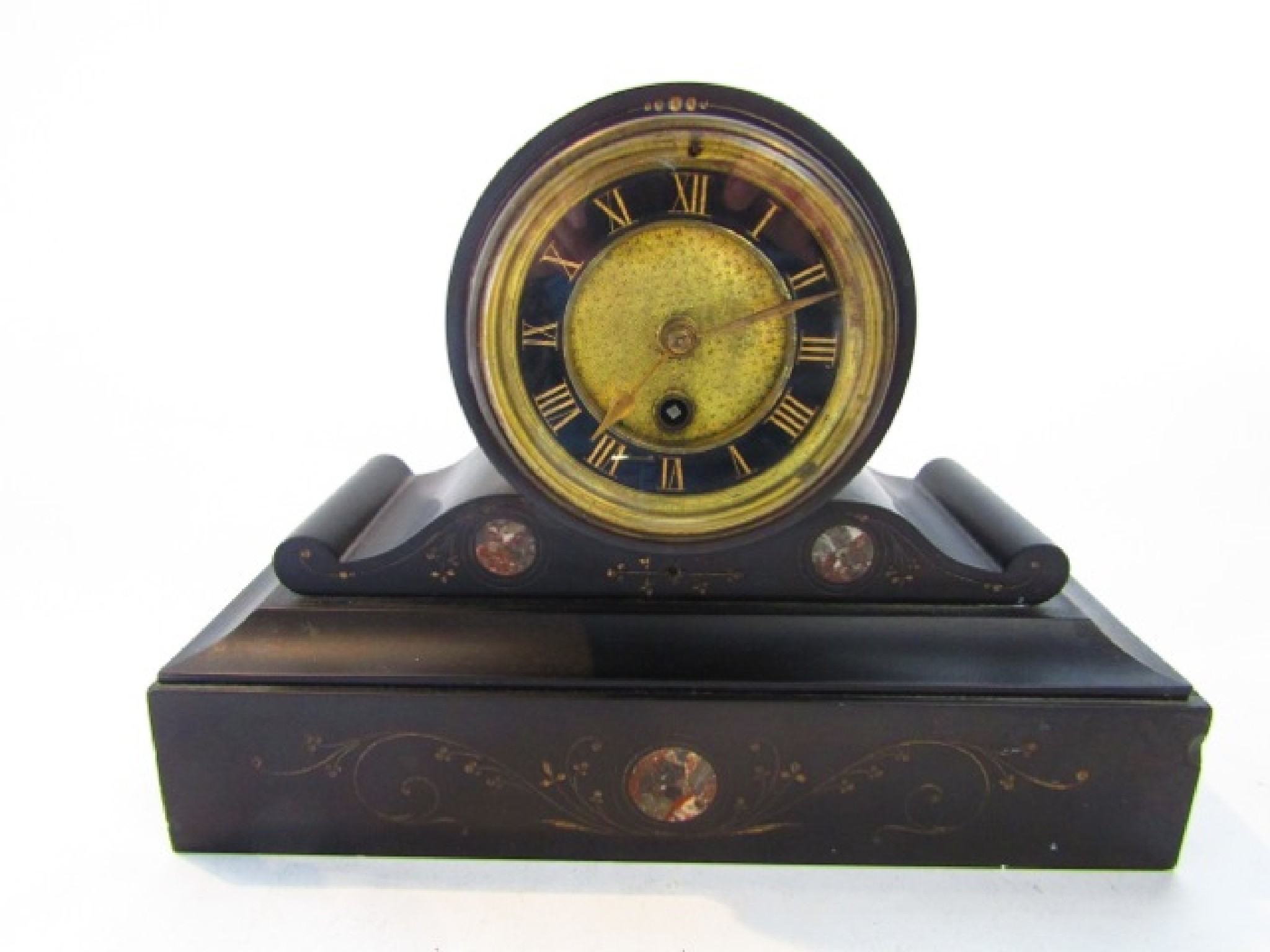 Appraisal: A Victorian black slate and polished marble mantel clock enclosing