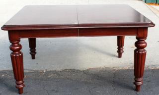 Appraisal: Mahogany dining table with fluted tapered legs Mahogany dining table