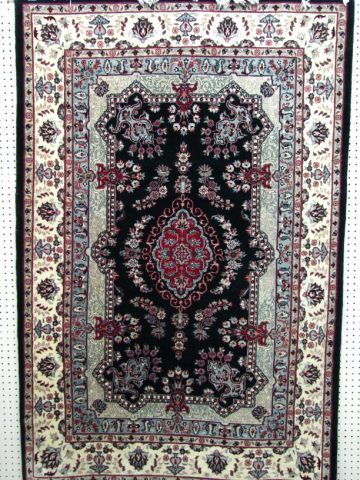 Appraisal: Traditional Persian design area rug x black field and light