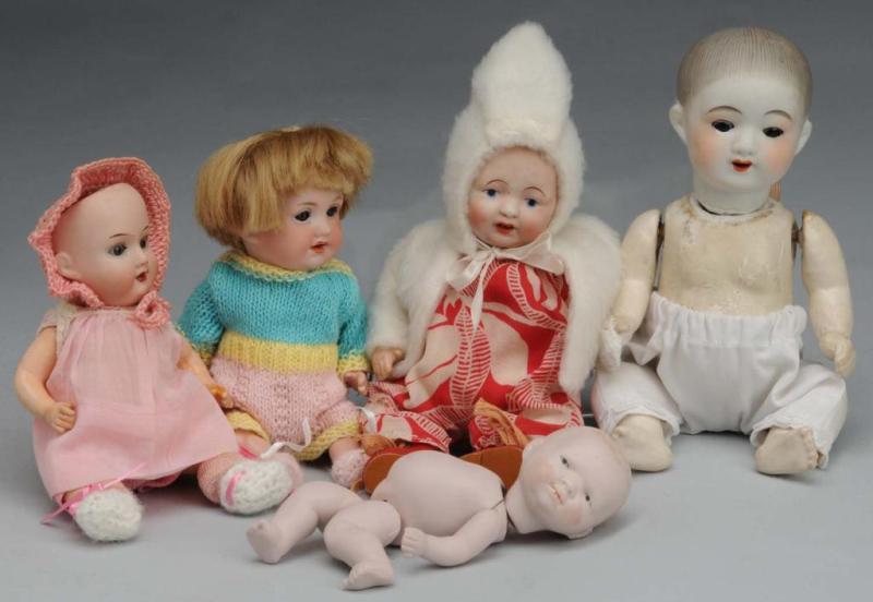 Appraisal: Lot of Bisque Dolls Description Two Japanese made babies one